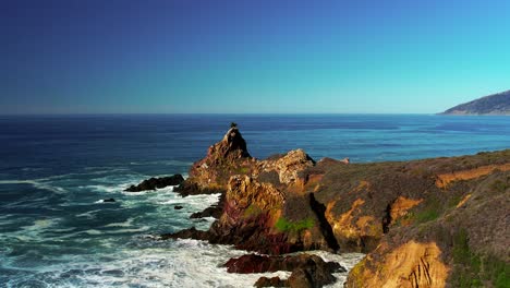 drone shot of waves crashing on scenic coastline at big sur state park off pacific coast highway in california 11