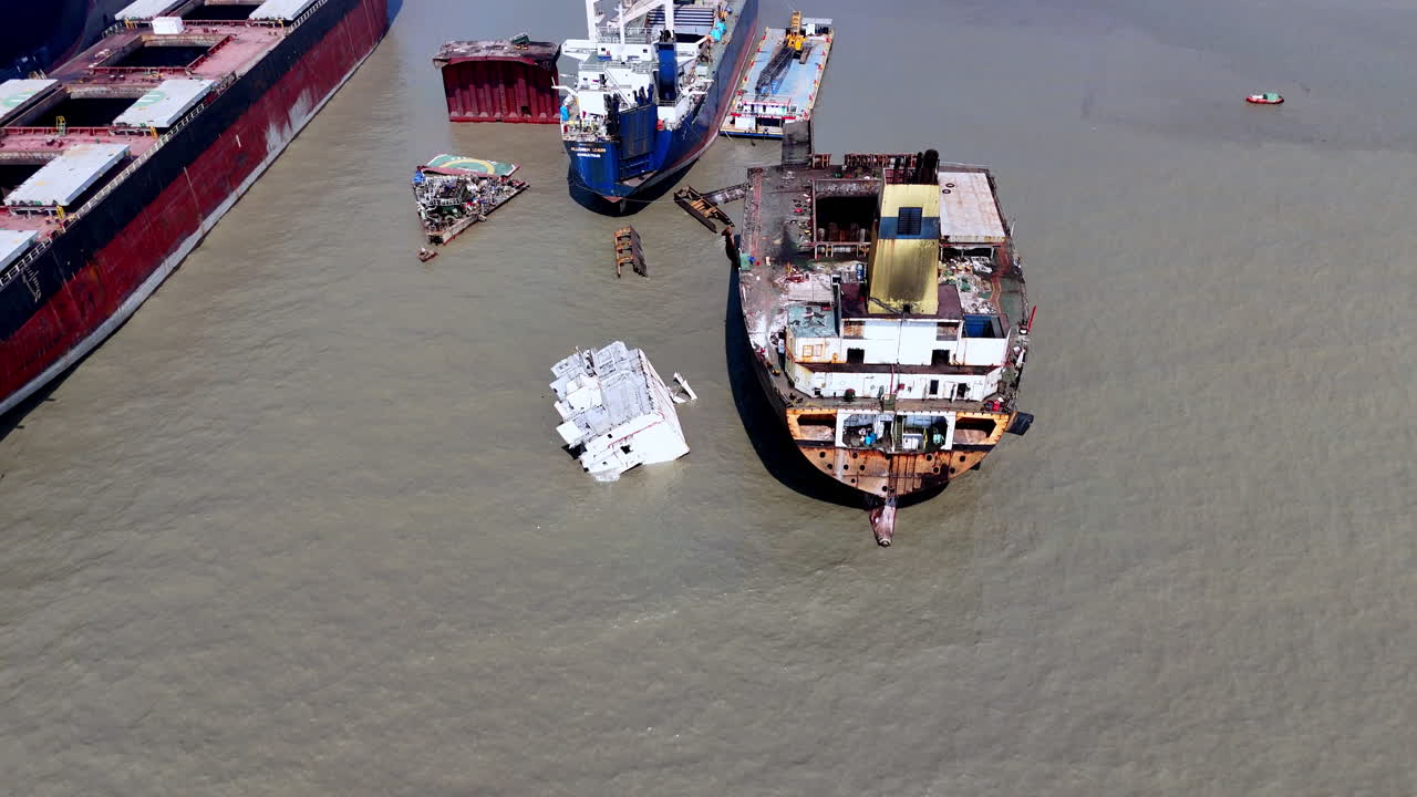 Cinematic aerial shot of abandoned wreckage and ships in a ship graveyard in Bangladesh