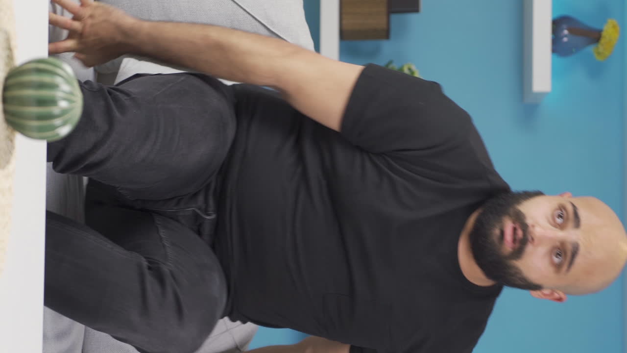 Vertical video of Man with Psychological Problems alone at home.
