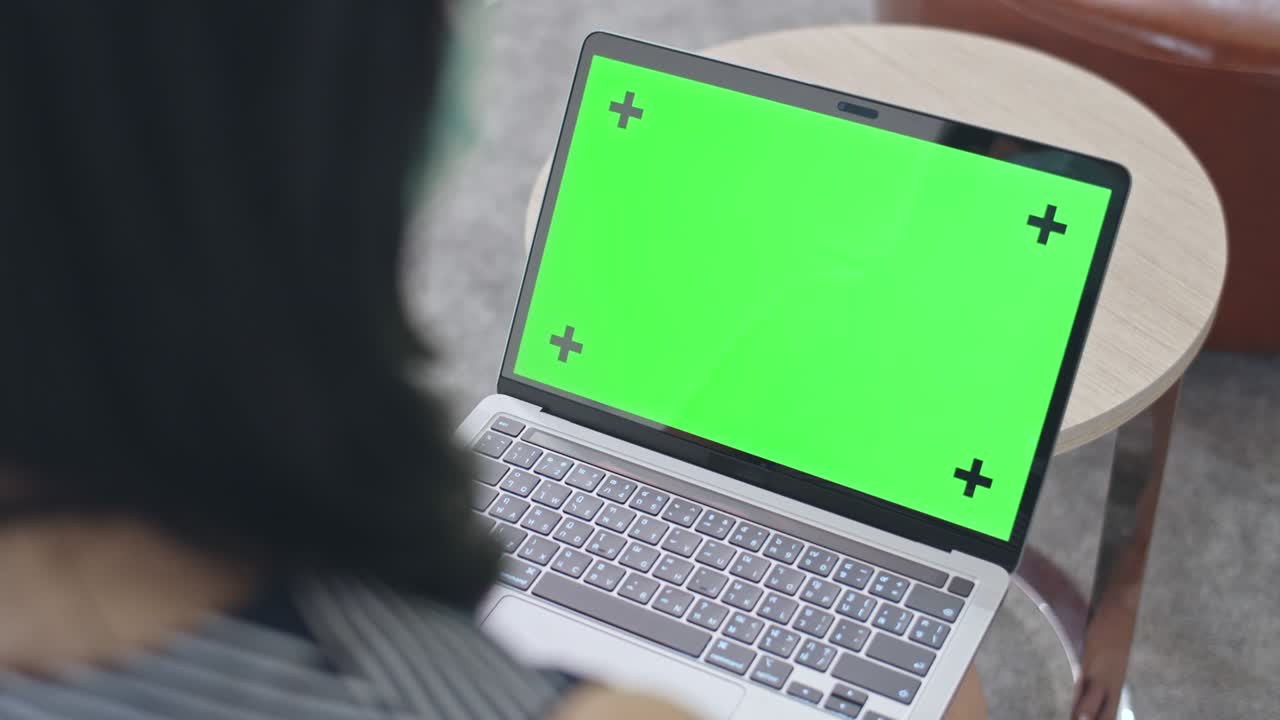 Close-up Woman Using Chroma key screen laptop computer