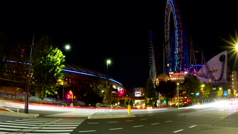 lapso nocturno 4k incluyendo el domo de tokio rueda gigante amplia zoom out