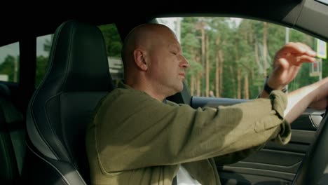 man driving a car