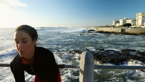 woman jogging near seaside 4k