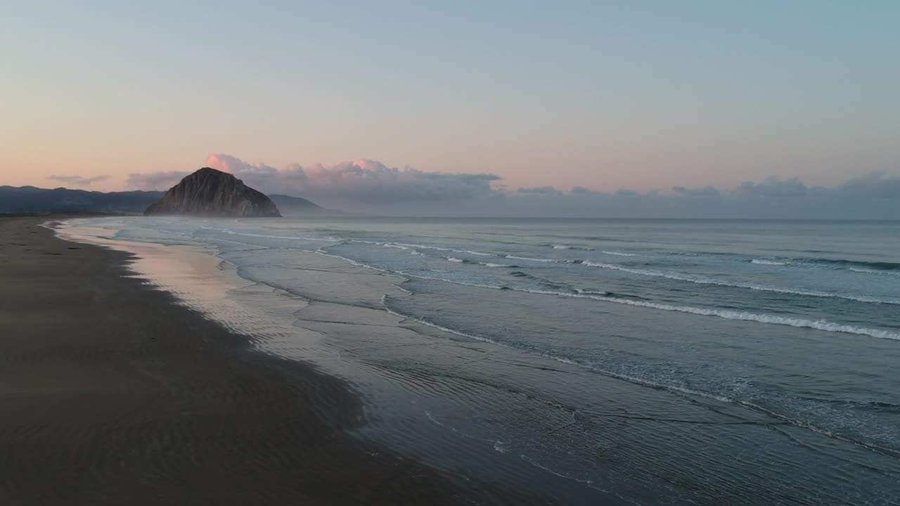 Stunning Sunrise over a Calm Ocean Beach