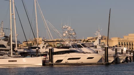 time-lapse of boats in a marina at sunset