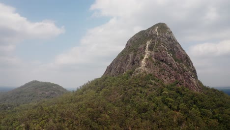 Aerial-View-of-Mountains-Beerwah-And-Coonowrin-In-Glass-House-Mountains-Region-In-Queensland,-Australia---orbital-drone-shot