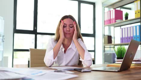 Stressed Businesswoman Dealing with Work Overload in Office
