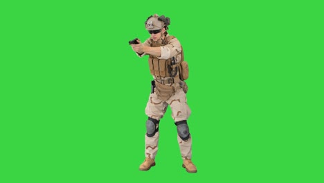 army man pointing gun in multiple directions ready for combat on a green screen, chroma key