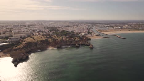 Rocky-cliffs-surrounding-the-marvelous-Burgau-beach-in-Portugal