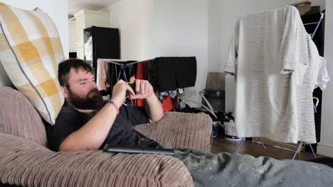 man watches video on his mobile device