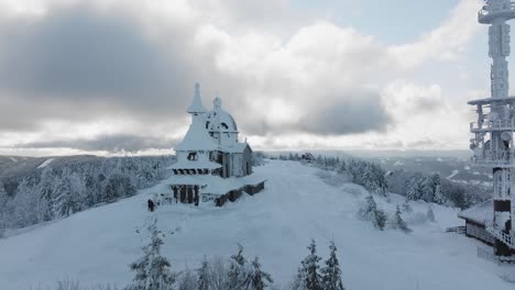 flying by the radhost chappel during a morning golden hour in winter, beskydy 4k