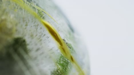 yellow liquid running down a frozen flower