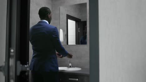 businessman getting ready in a bathroom