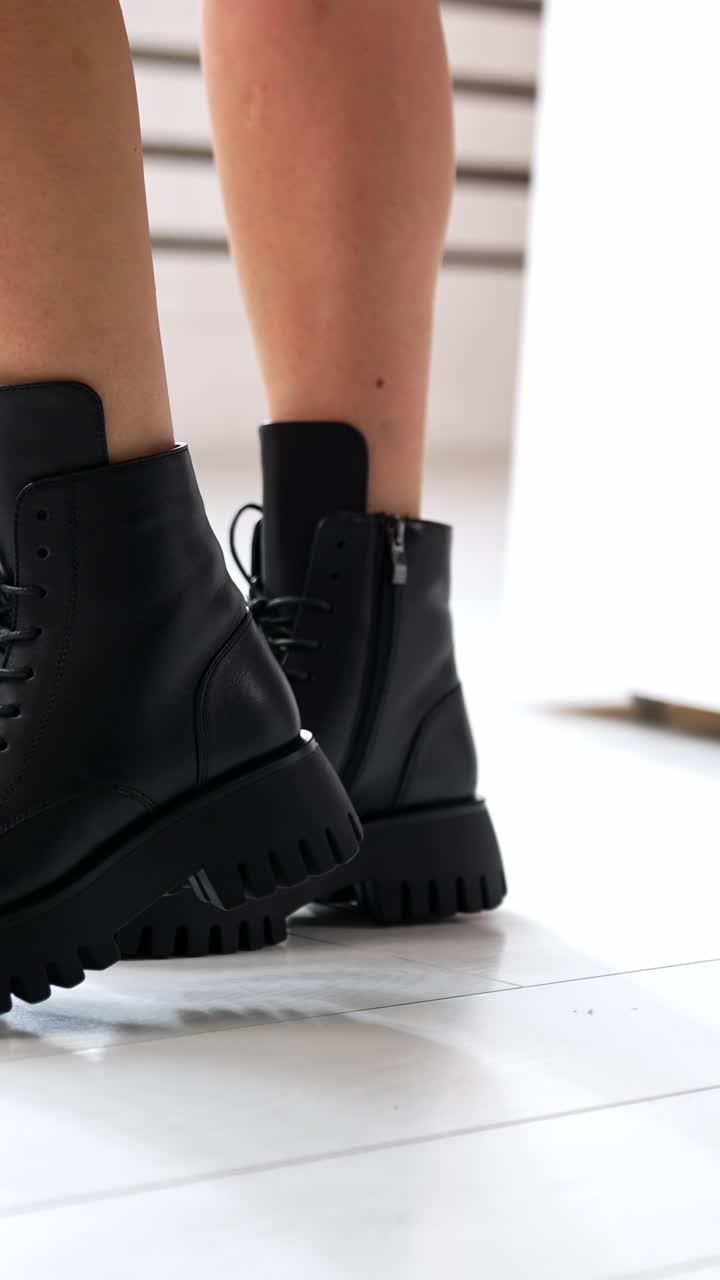 Woman shoes showroom posing. Lifestyle stylish footwear trying. Vertical video