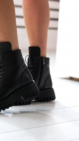 woman shoes showroom posing. lifestyle stylish footwear trying. vertical video