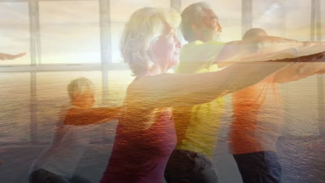 animation of glowing lights over senior men and women exercising and clouds background