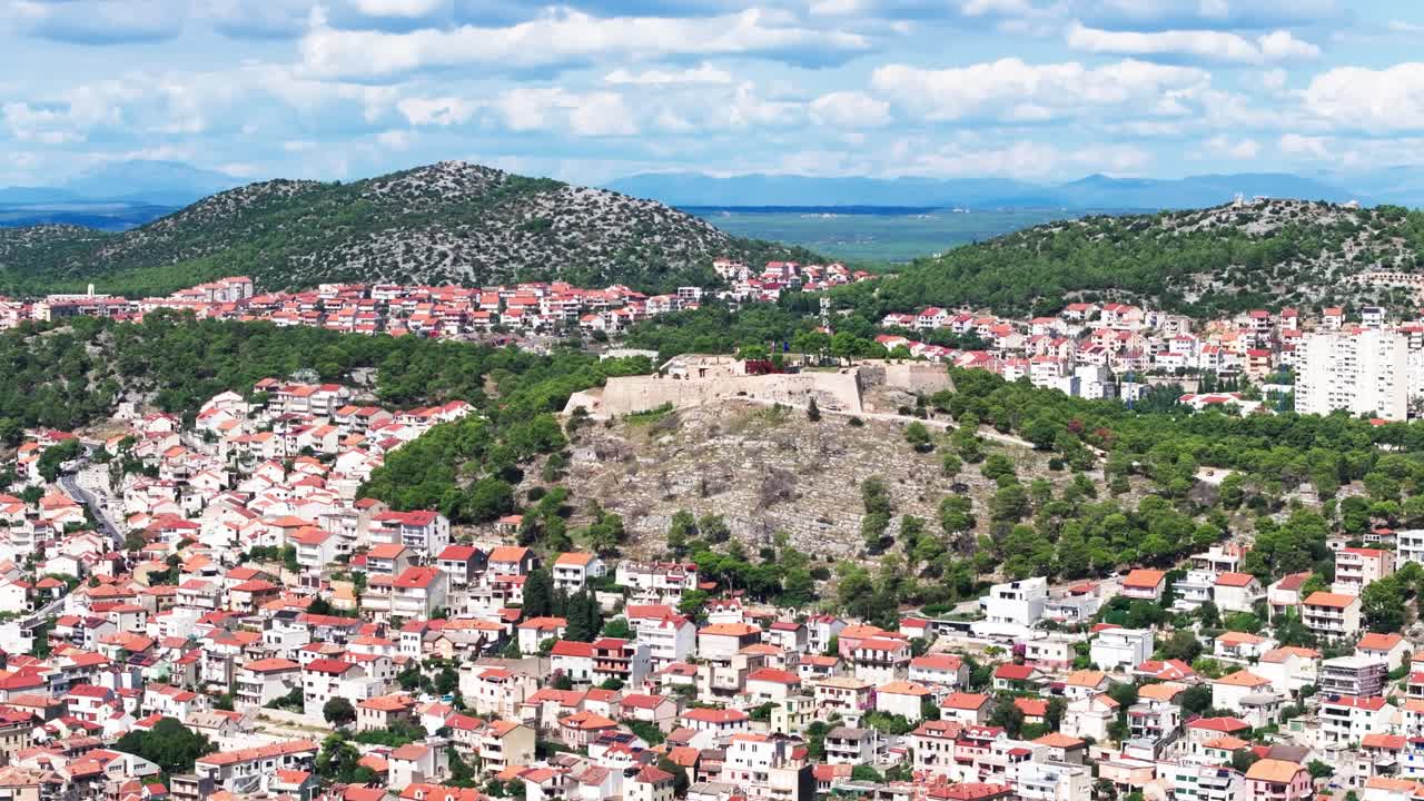 Barone fortress and Sibenik city around, aerial orbit view