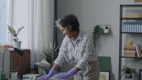 woman cleaning her home office