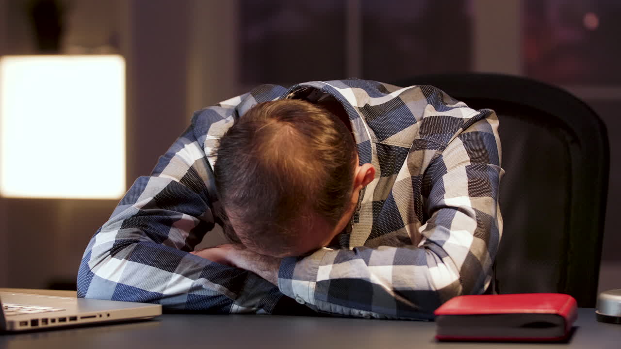 Man sleeping at desk