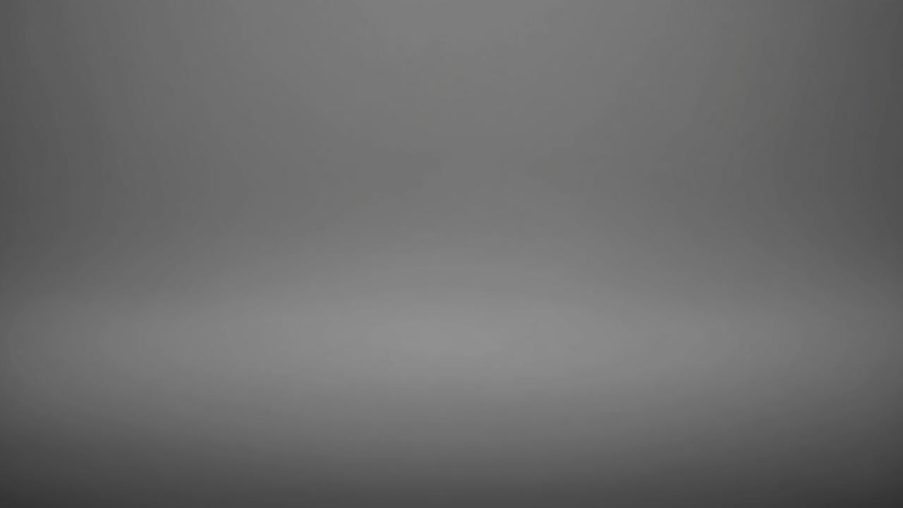 Soft gray gradient background creating a smooth and elegant backdrop, perfect for various design projects or presentations, providing a neutral and versatile canvas