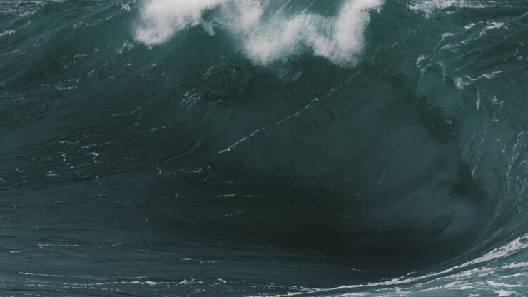 Close up of a heavy wave folding onto a shallow reef break