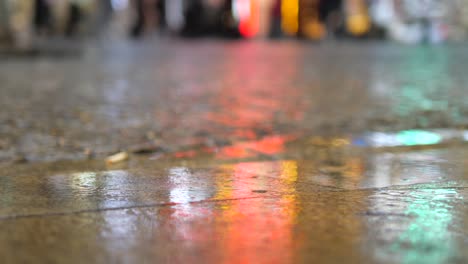 wet street with city lights reflections at night