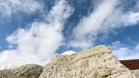 white cliffs under a partly cloudy sky