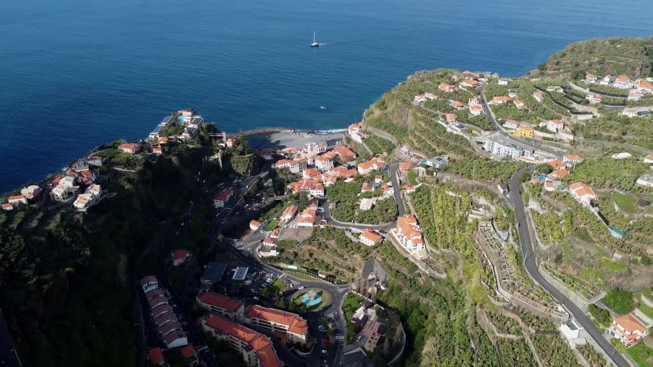 Drone flying along Madeira’s dramatic coastline with cliffs and ocean waves. Scenic aerial view perfect for travel, adventure, and nature content
