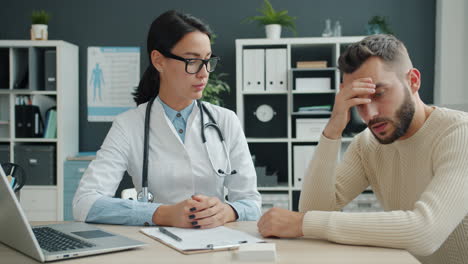 doctor consoling a patient