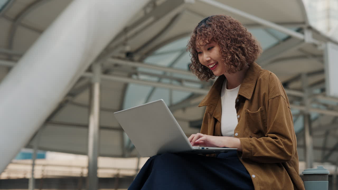 Woman Working on Laptop Outdoors