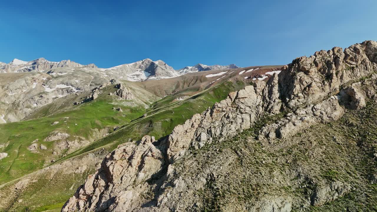 Aerial view of rocky mountains in summer, peaceful nature scene
