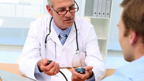 doctor taking blood pressure of his patient