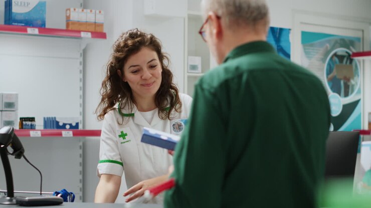 Pharmacist helping customer in a pharmacy