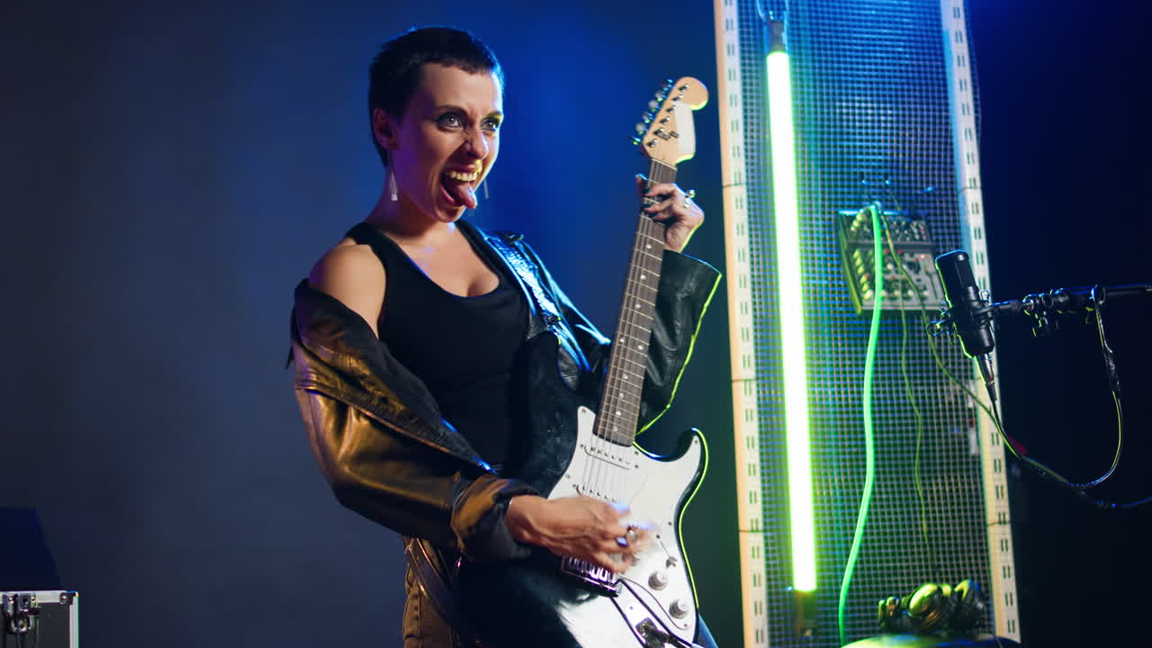 Woman performing music on electric guitar