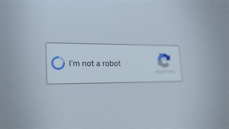 Mouse clicking on I&#039;m not a robot button on a computer screen confirming that the user is human