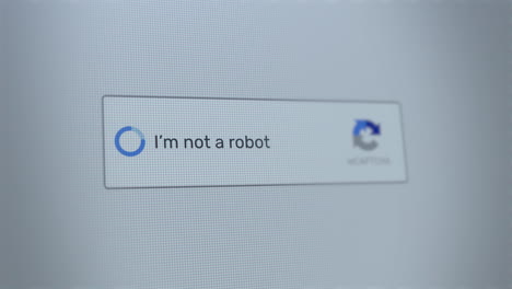 mouse clicking on i'm not a robot button on a computer screen confirming that the user is human