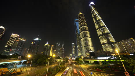 Timelapse of the Shanghai city skyline with traffic passing at nigh