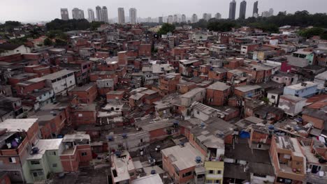 aerial view over ramshackle houses and streets, poverty in sao paulo, brazil