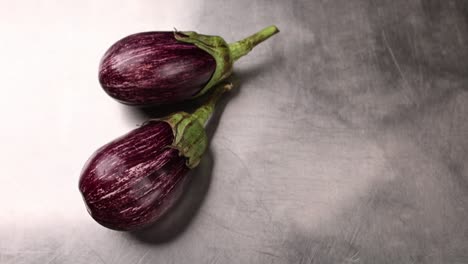 two purple eggplants