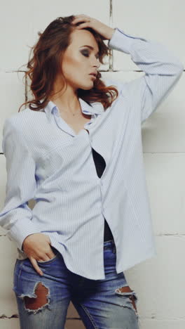 stylish wearing woman. young sexy woman posing in style clothes on background in studio