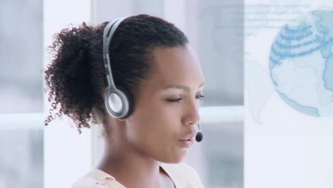 animation of globe of connections over businesswoman using phone headset