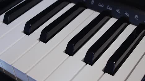 male hand playing piano keys