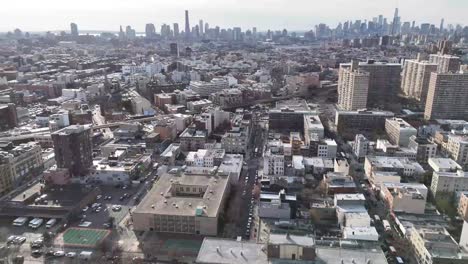 Horizontal drone arc shot over Varet Street in Brooklyn, showcasing New York’s vibrant cityscape, historic buildings, and dynamic urban atmosphere with a smooth, sweeping motion.