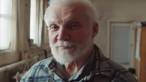 portrait of senior sculptor in workshop