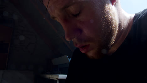 man sweating heavily in a hot room