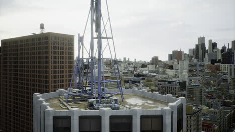 City skyline view from rooftop with antenna and urban buildings