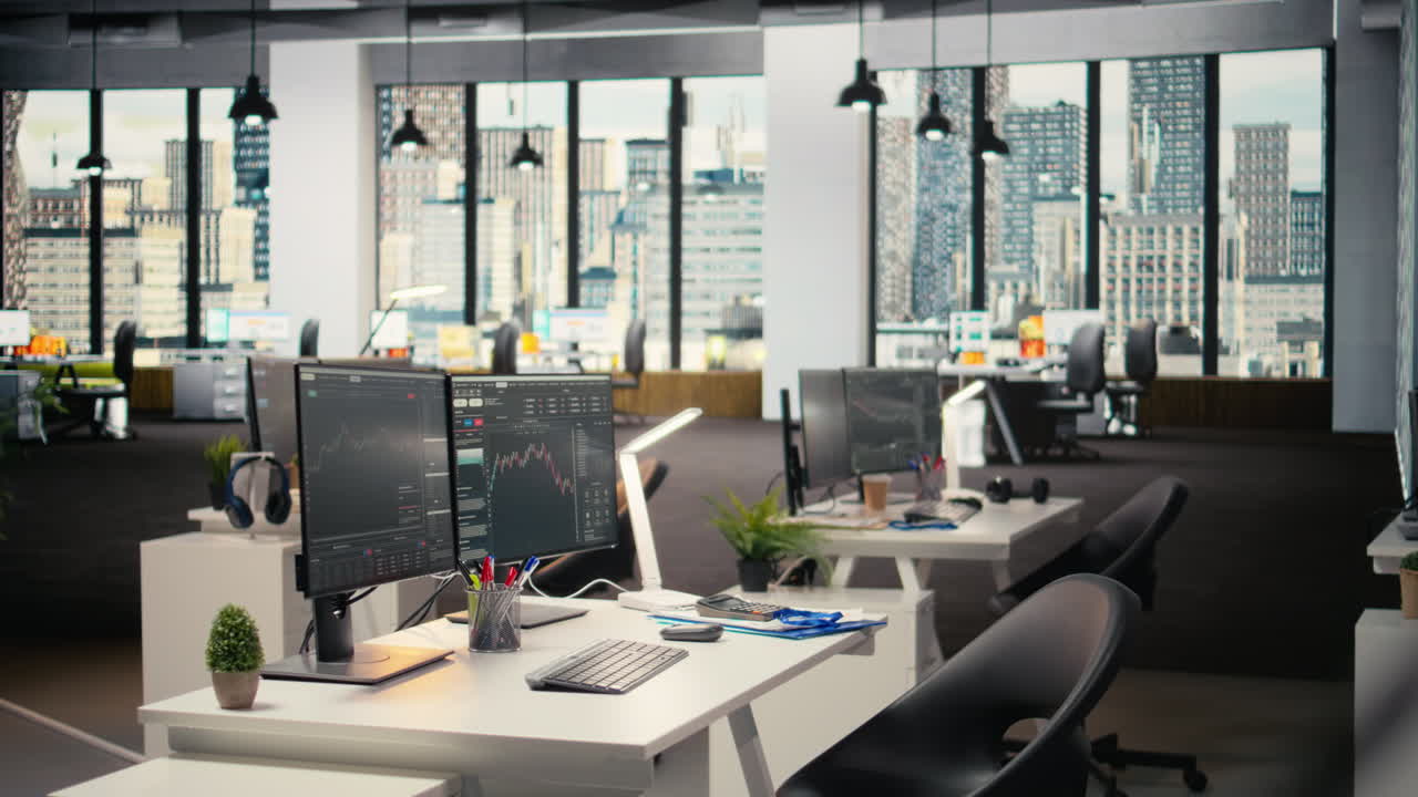 Stock exchange metrics charts displayed on computer screens in investment firm