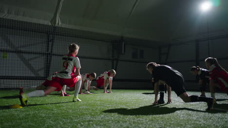 women's soccer team stretching before a game