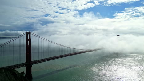 iconic golden gate bridge shrouded in fog in san francisco, california