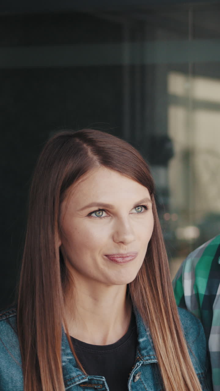 Beautiful woman with long brown hair looking away with a slight smile